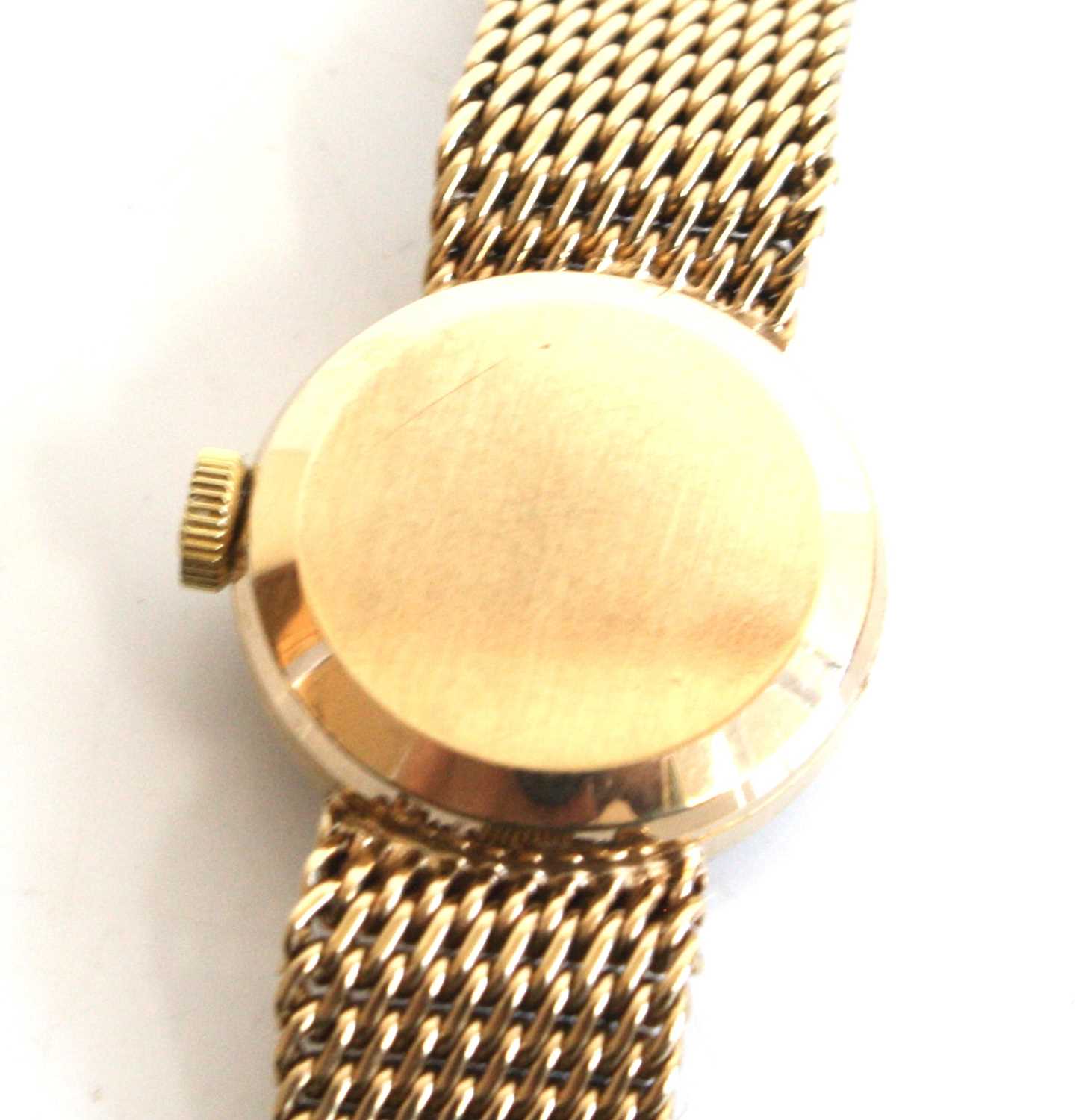 A lady's 9ct yellow gold Omega manual wind wristwatch with round silver baton dial and integral - Image 5 of 7