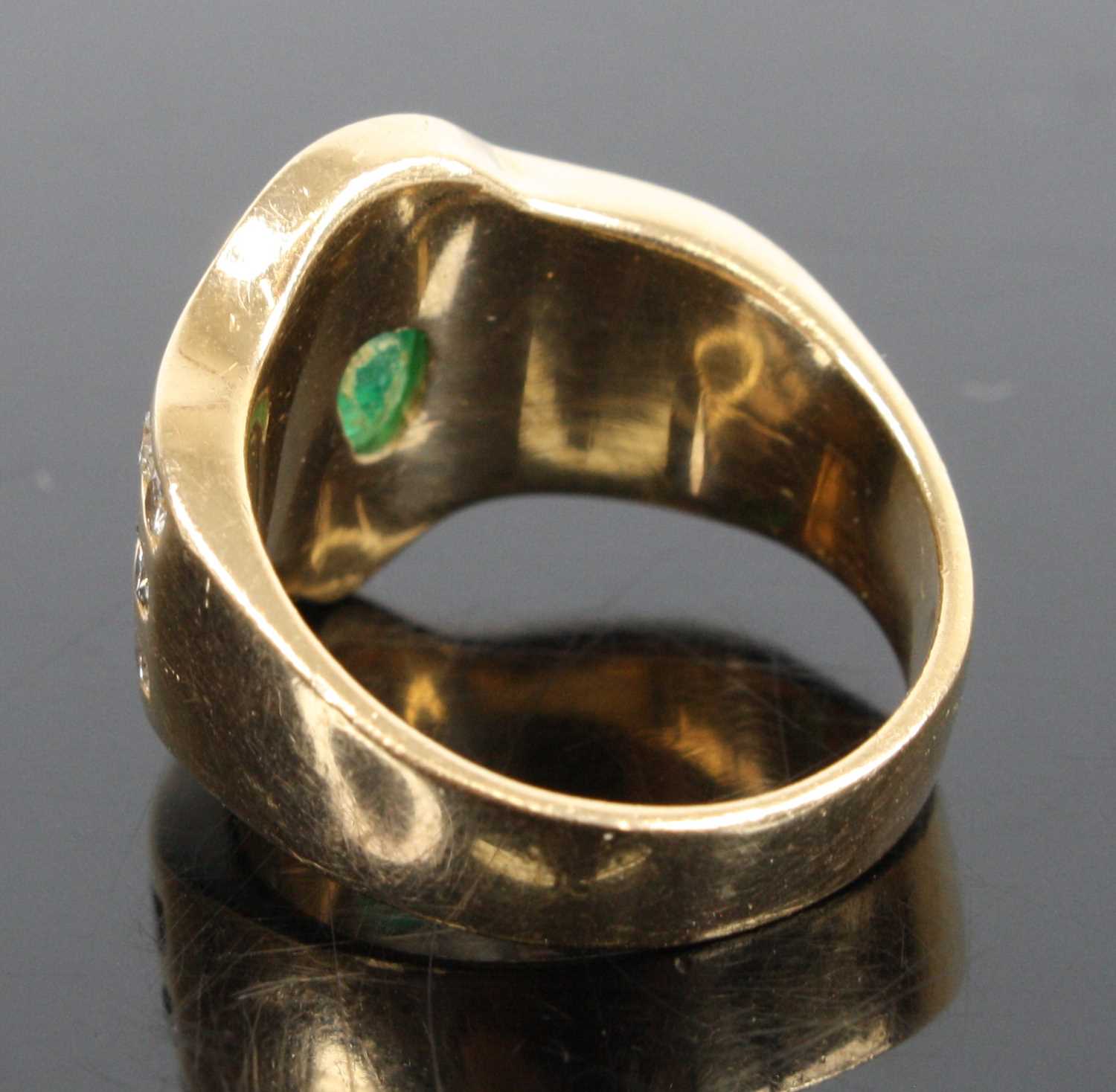 A 14ct yellow gold emerald and diamond dress ring, featuring a centre pear cut emerald in a bezel - Image 4 of 4