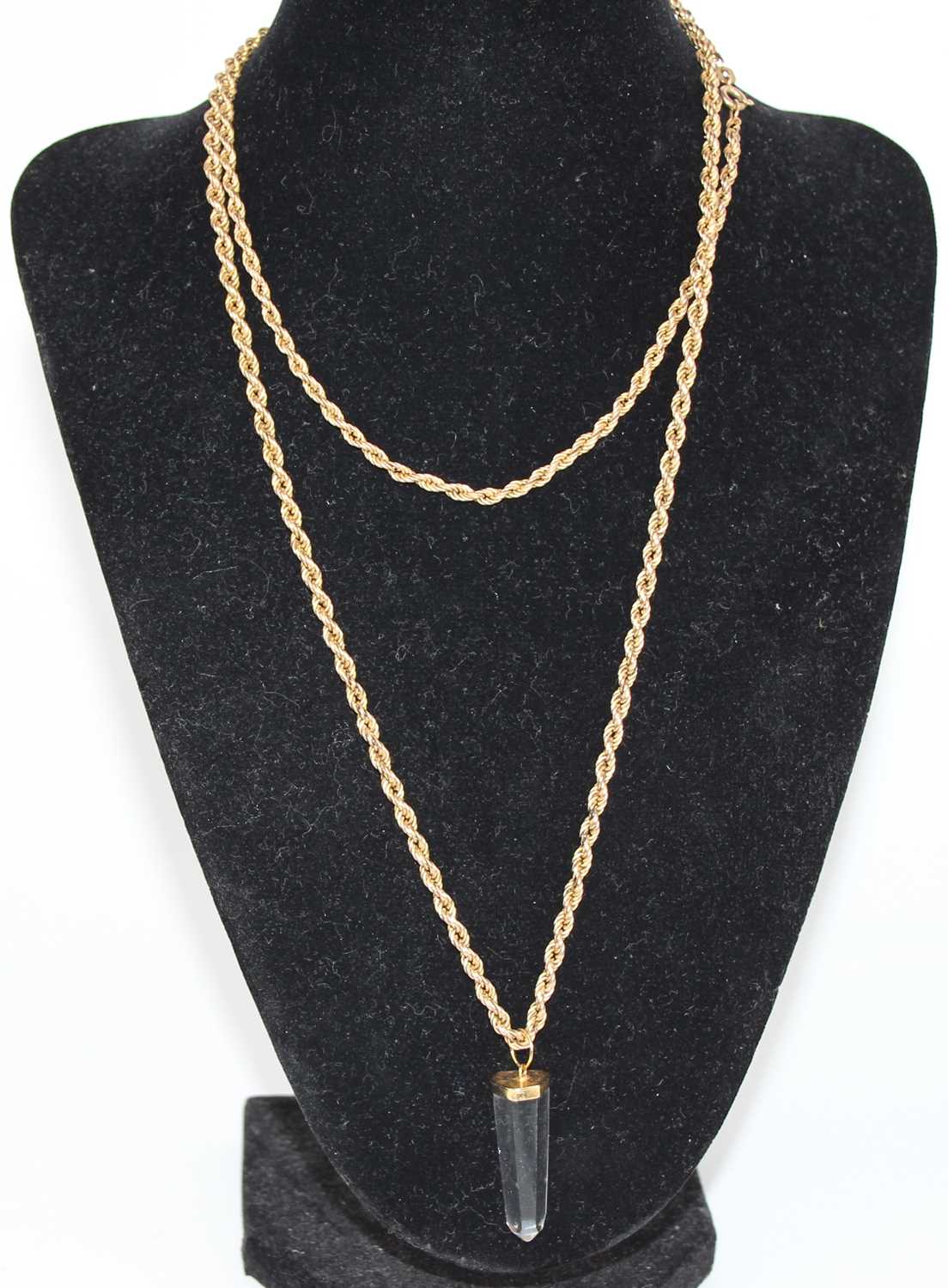 A modern 9ct gold ropetwist necklace, 9.4g, 41cm, containing gilt metal and crystal pendant