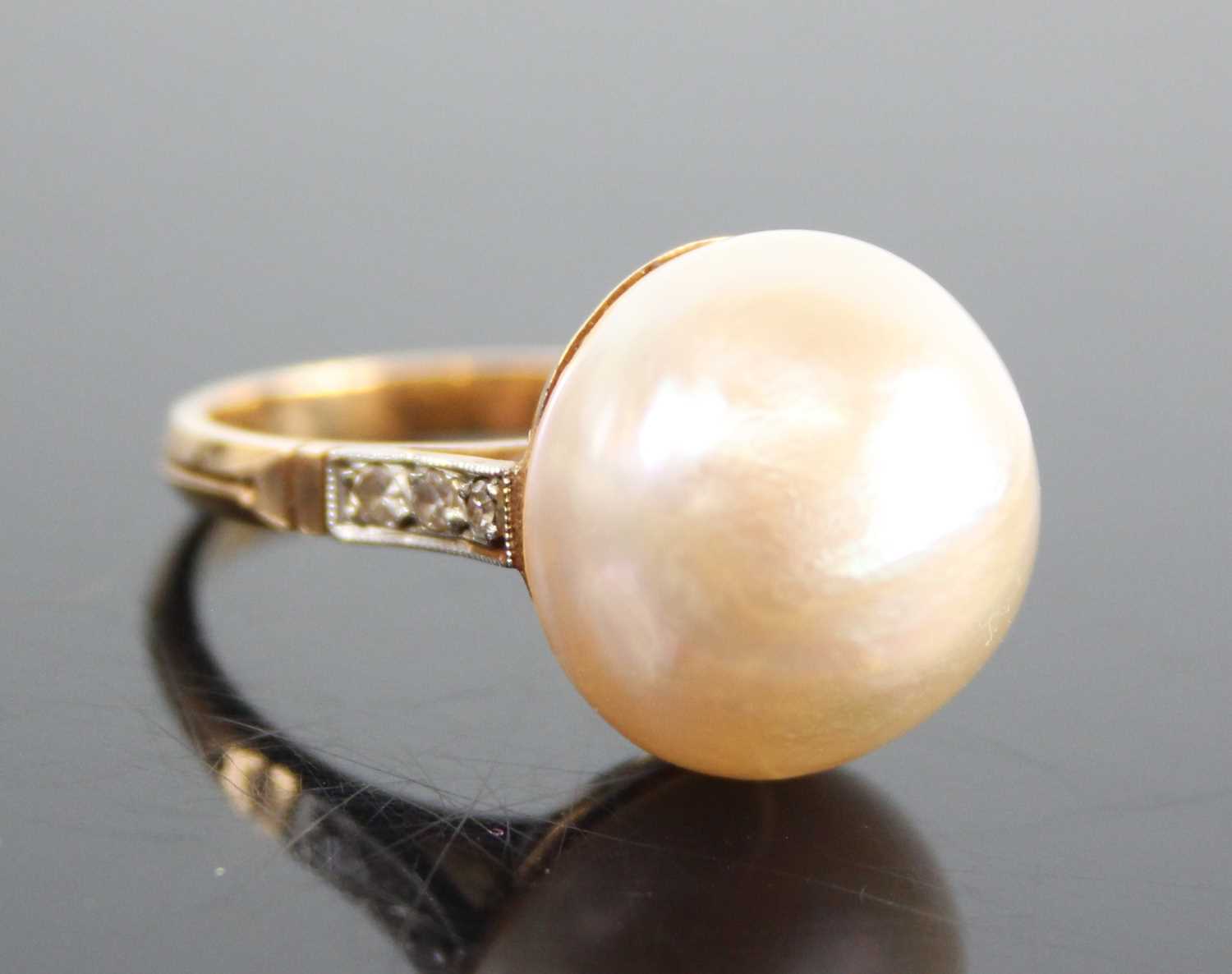 A rose and white metal mabé cultured pearl and diamond dress ring, the mabé cultured pearl measuring