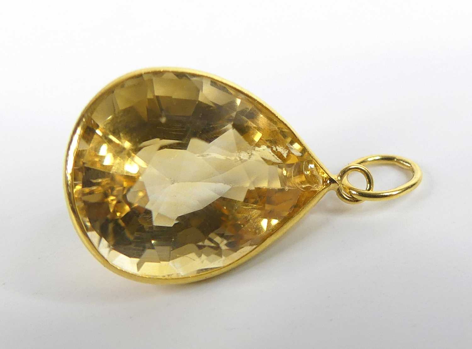A yellow metal citrine pendant, having a pear cut citrine in a bezel setting, citrine dimensions - Image 3 of 3