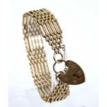 A 9ct gold gatelink bracelet, having heart shaped padlock clasp and safety chain, 27g, 18.5cm