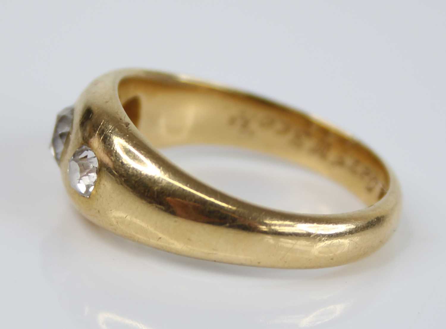 A gent's 18ct gold diamond three-stone ring, the flush set graduated old cushion cuts total weight - Image 4 of 5