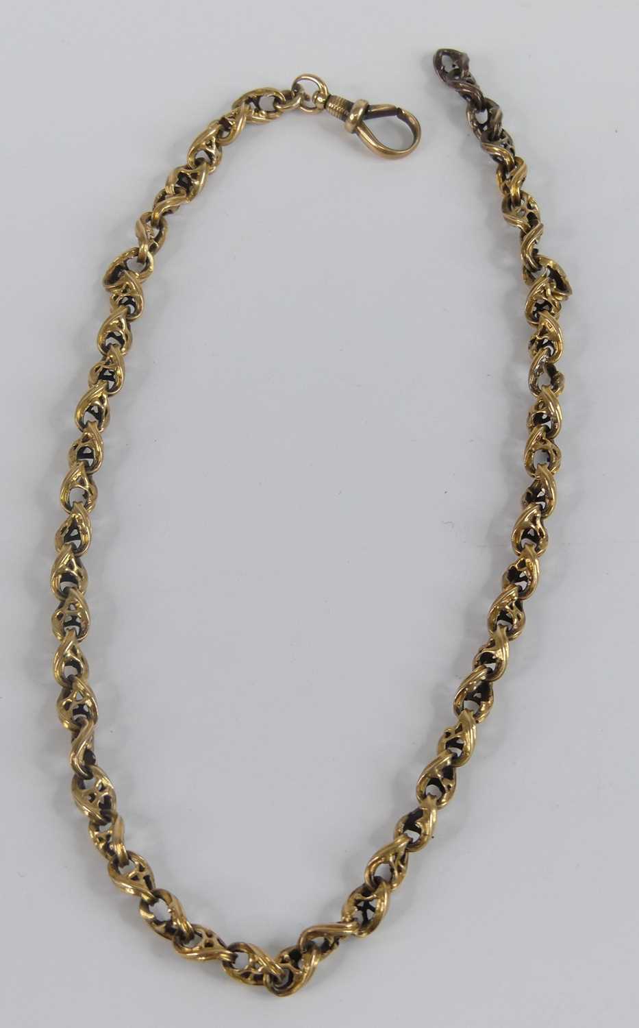 A yellow metal fancy figure-of-eight style link Albert chain, with swivel clasp, length 350mm, chain - Image 2 of 2