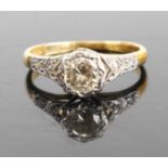 An 18ct gold diamond solitaire ring, the tinted illusion set round cuts weighing approx 0.4ct, 2.5g,