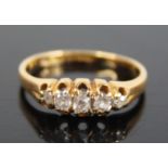 An 18ct gold diamond half hoop ring, arranged as five graduated claw set old cushion cuts, total