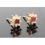 A pair of yellow metal ruby and white stone set flowerhead ear studs, the square cut rubies