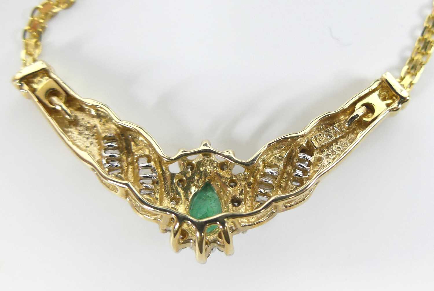A yellow metal, emerald and diamond pear shaped cluster pendant, comprising a pear cut emerald - Image 4 of 5