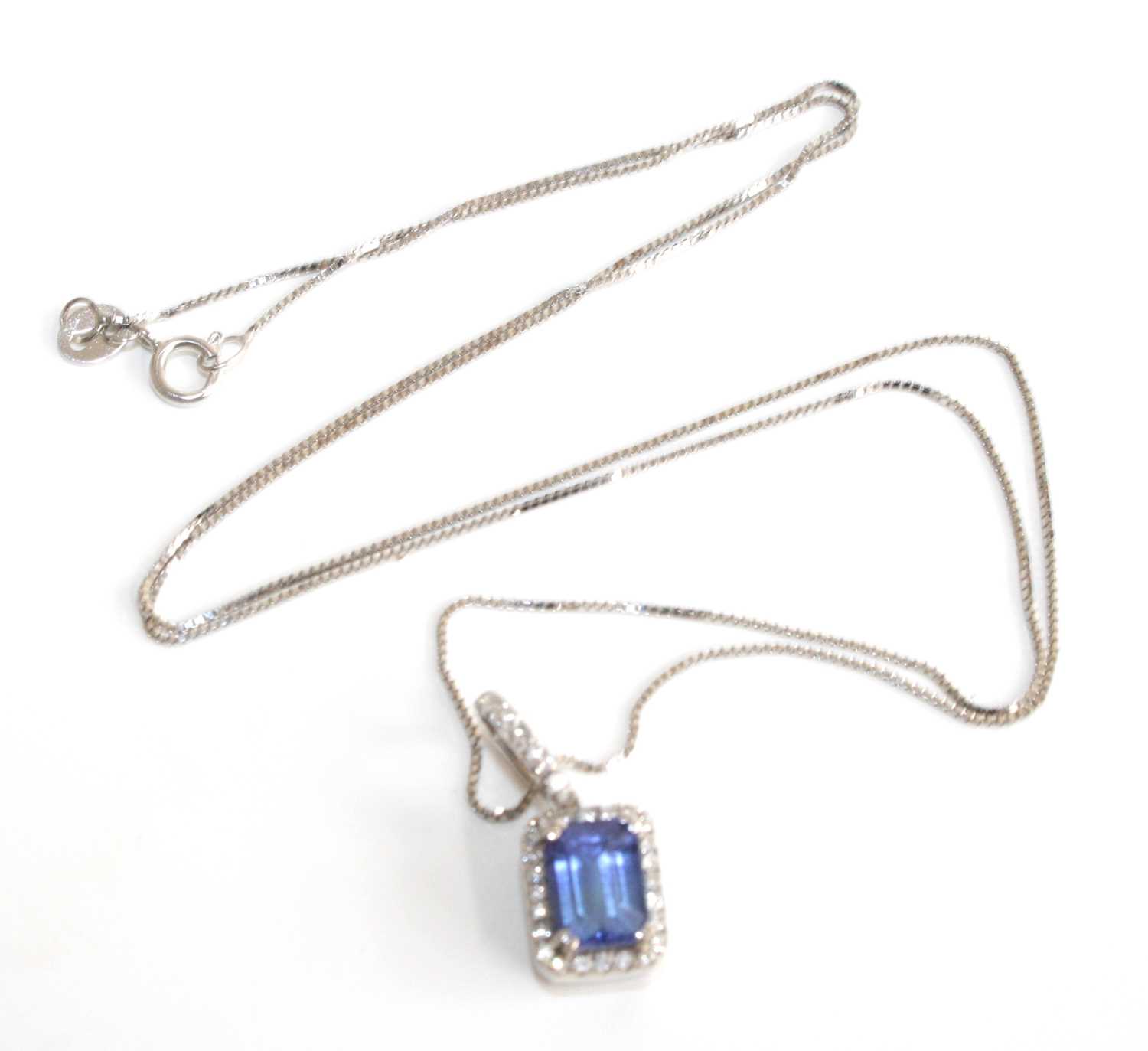 A white metal, tanzanite and diamond rectangular cluster pendant, featuring a centre step-cut - Image 3 of 5