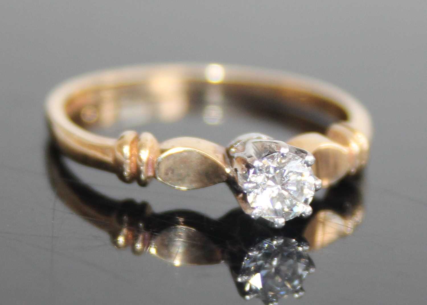 A 9ct gold diamond solitaire ring, the claw set round brilliant weighing approx 0.2 carats, 1.7g,