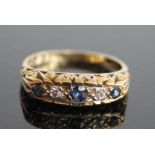 A 9ct yellow gold, sapphire and diamond half hoop eternity ring, featuring three graduated round