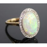 An 18ct yellow and white gold, opal doublet and diamond oval cluster ring, the opal doublet