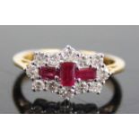 An 18ct yellow and white gold, ruby and diamond lozenge shaped cluster ring, featuring three