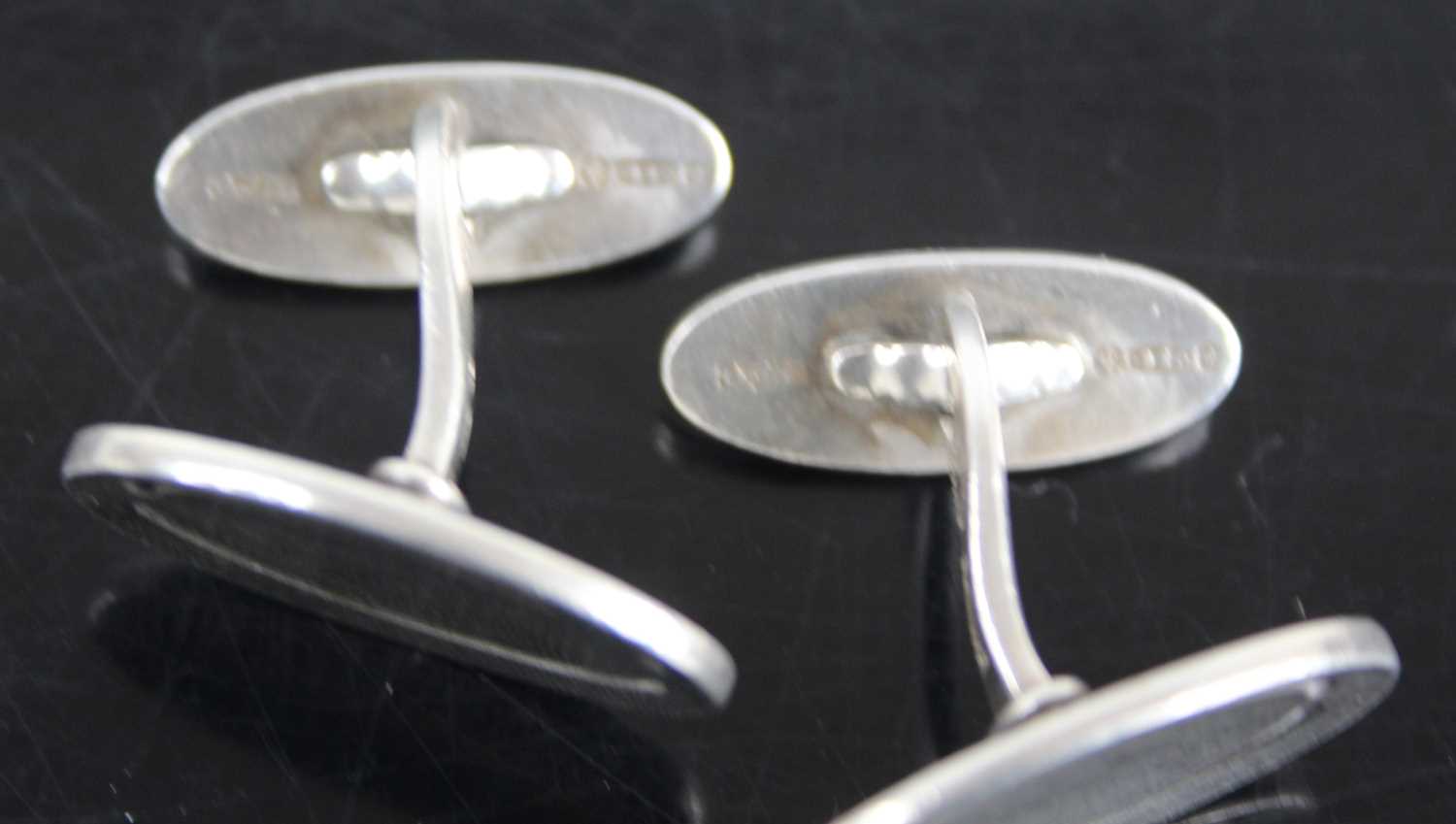 A pair of Georg Jensen sterling silver oval panel cufflinks designed by Poul Hansen, model No. 75, - Image 2 of 2