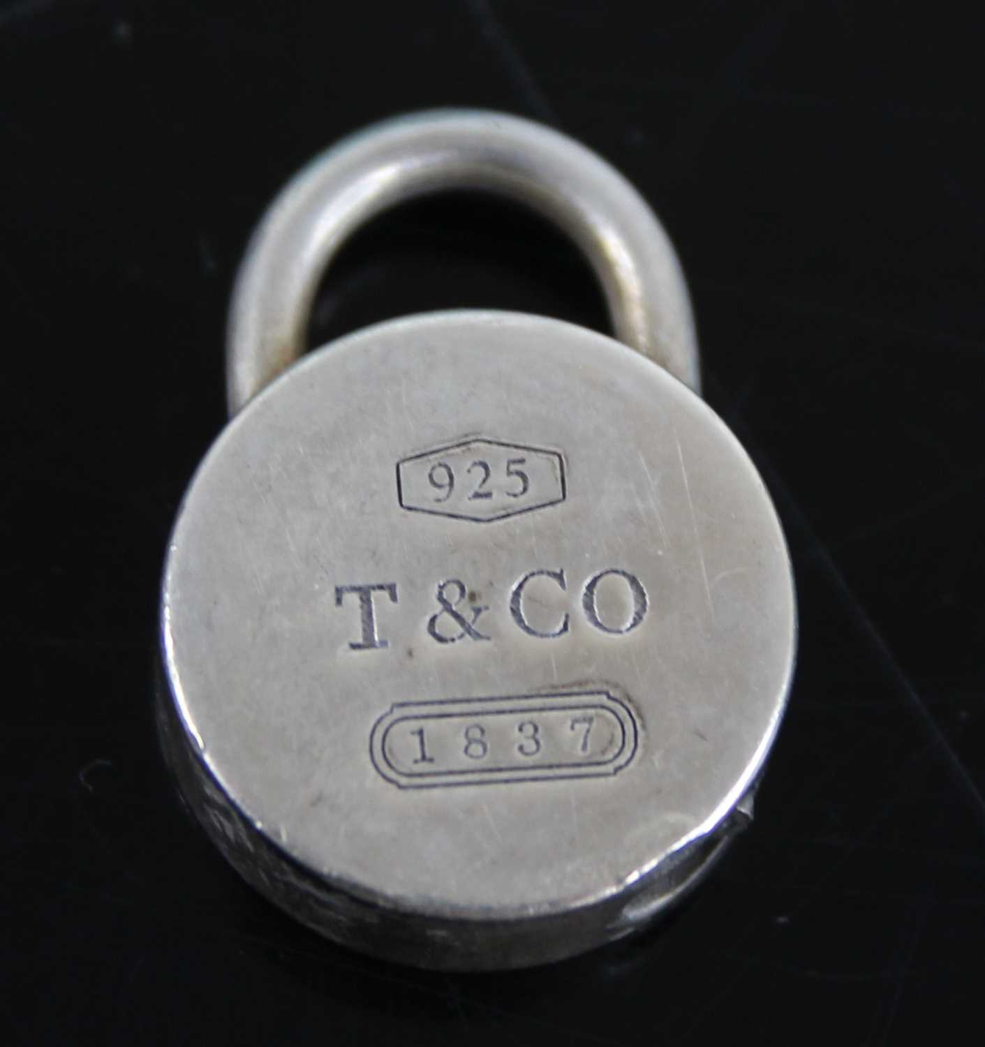 A Tiffany & Co silver bracelet, 19.5cm; together with two Tiffany & Co silver padlock clasps, - Image 3 of 6