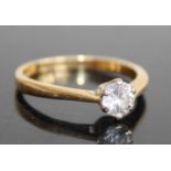 An 18ct gold diamond solitaire ring, the claw set round brilliant weighing approx 0.45 carats,