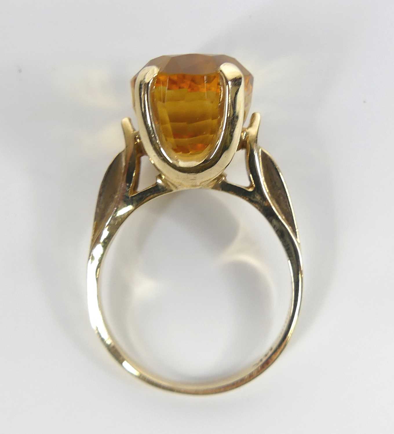 A yellow metal citrine single stone ring, featuring an oval citrine in a four-claw setting with - Image 6 of 7