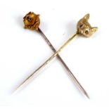 A 15ct gold round cut sapphire set tie-pin, 1.1g, 5.5cm; together with a 9ct gold fox head tie-