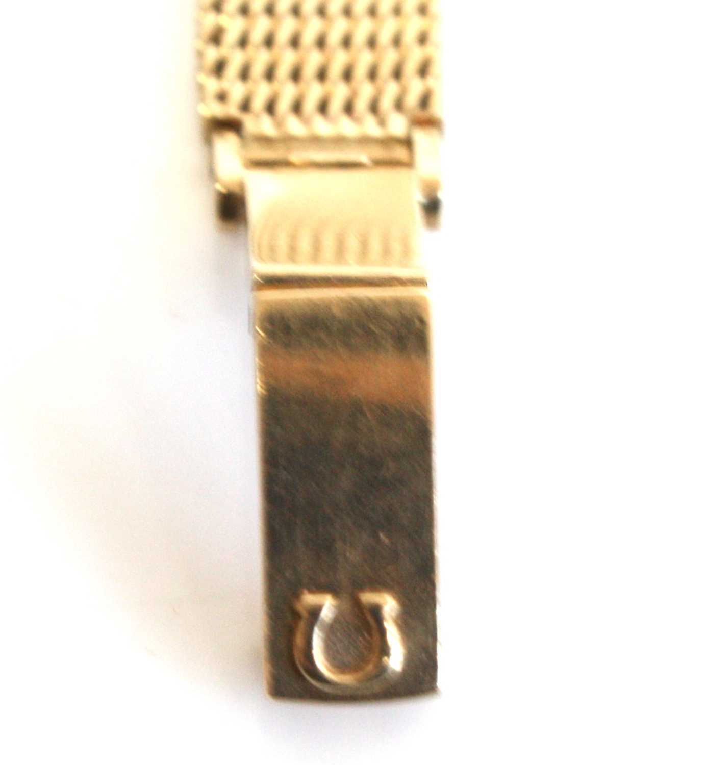 A lady's 9ct yellow gold Omega manual wind wristwatch with round silver baton dial and integral - Image 6 of 7