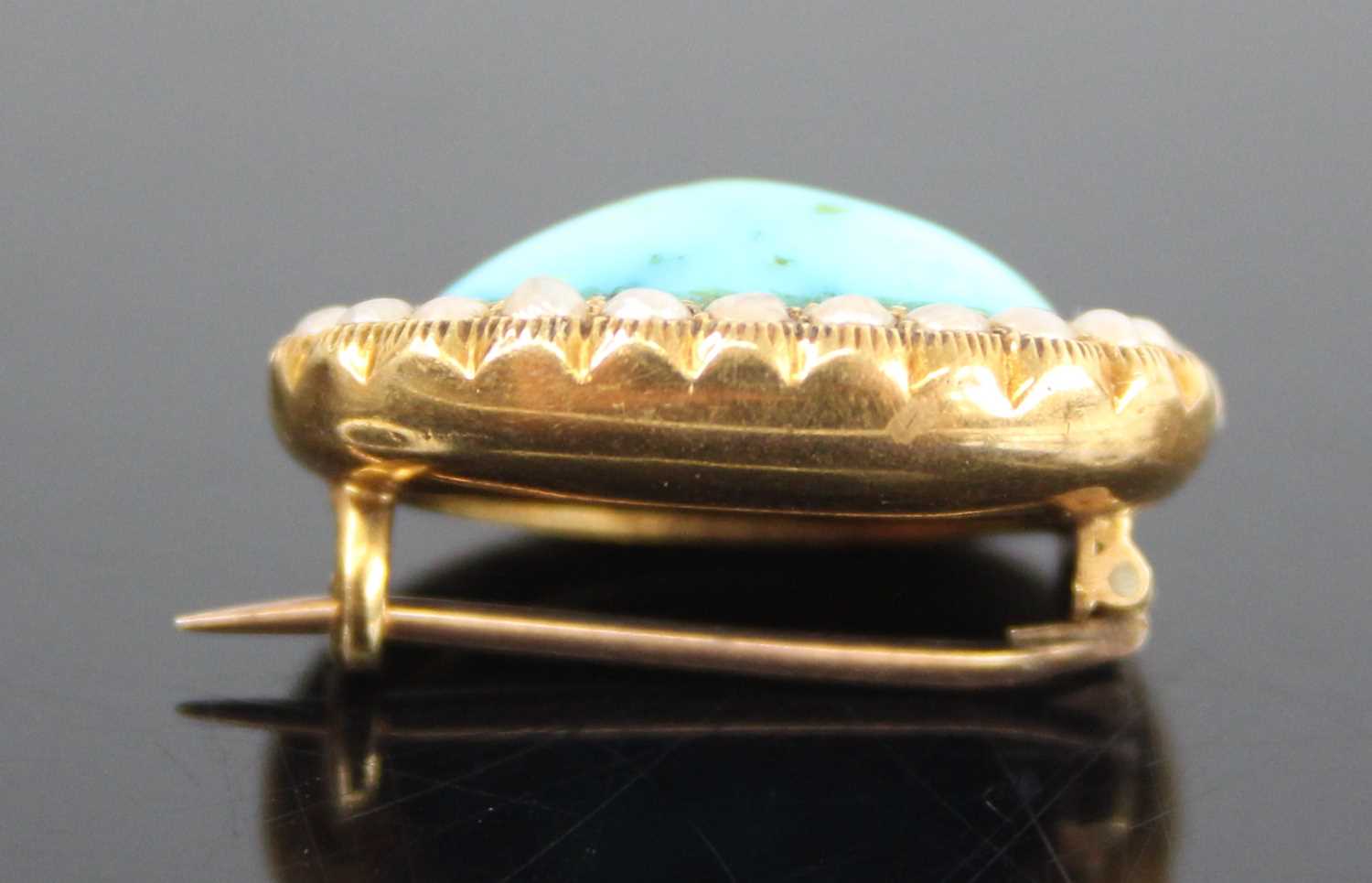 A yellow metal, turquoise and pearl oval cluster brooch, comprising a centre 14.78 x 9 x 5.55mm oval - Image 3 of 5