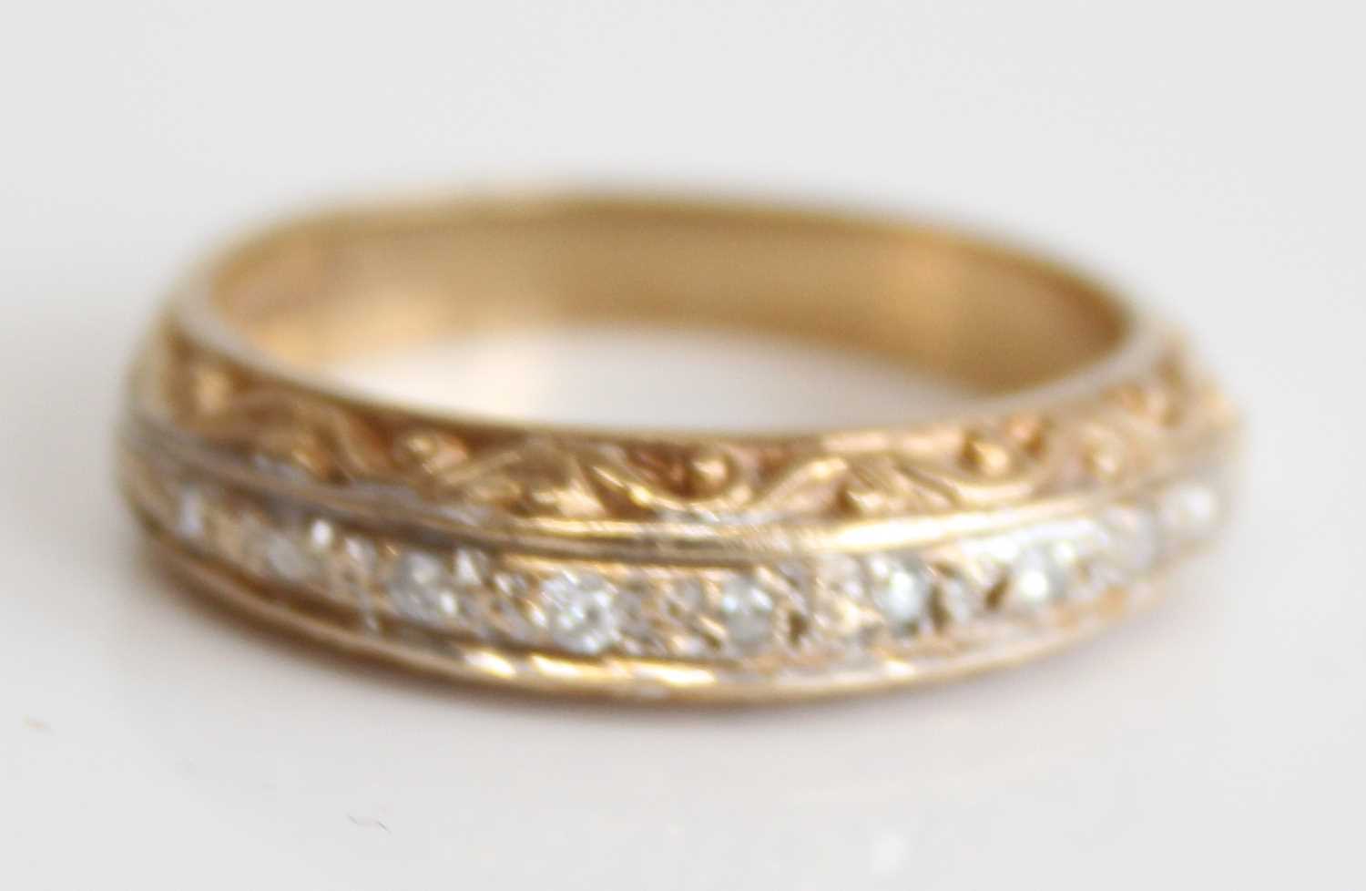 A 9ct gold diamond half eternity ring, arranged as nine small round cuts in a carved setting, - Image 6 of 7