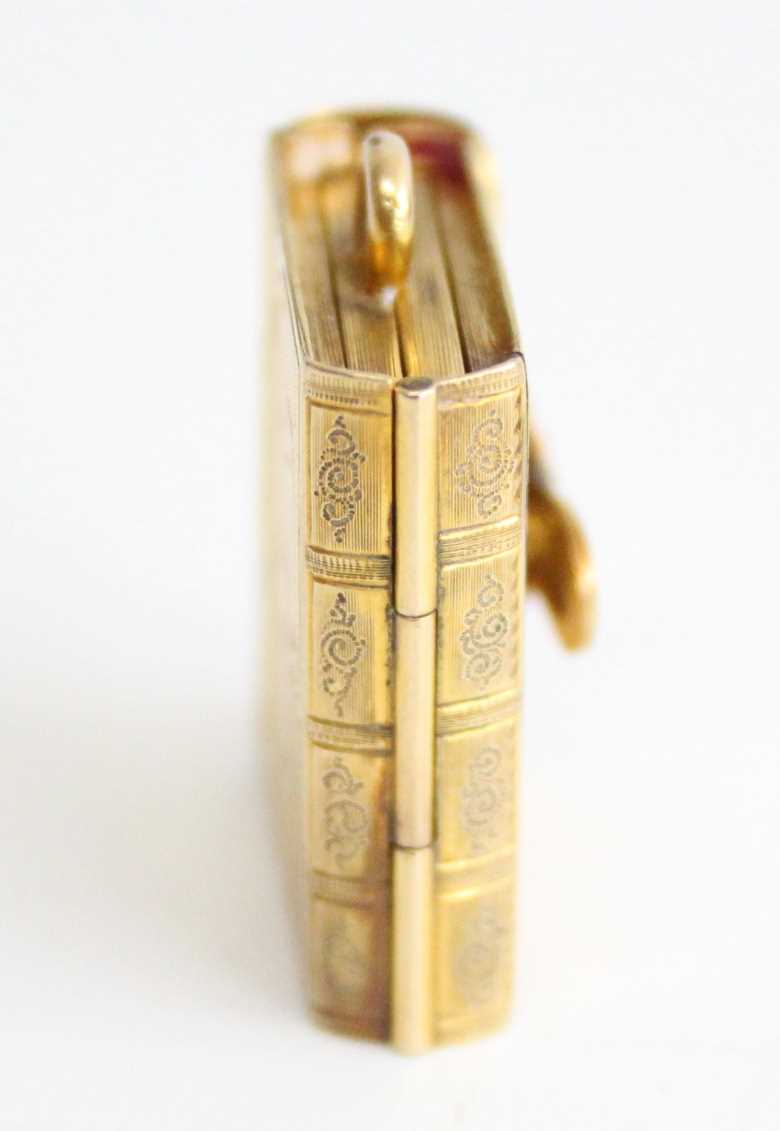 A late 19th century pendant locket in the form of a book, having concertina action to allow four - Image 4 of 5
