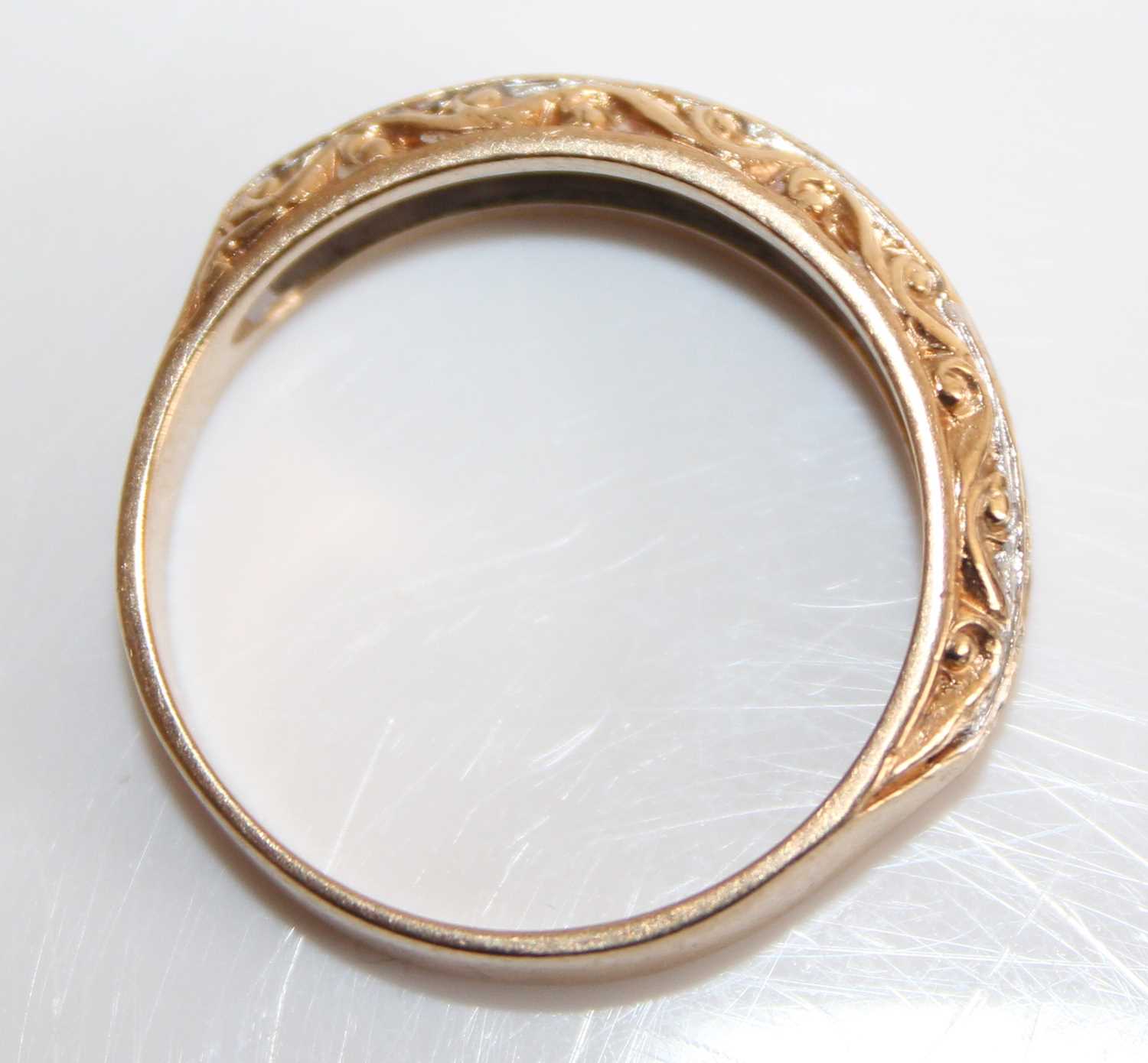 A 9ct gold diamond half eternity ring, arranged as nine small round cuts in a carved setting, - Image 5 of 7