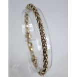 A modern 9ct gold spiga link bracelet, with lobster claw clasp, 17.5g, 19cm (matching to lot 2854)
