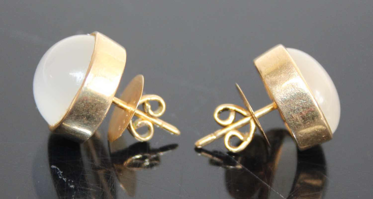 A pair of yellow metal cabochon moonstone set ear studs, the bezel set moonstones each measuring - Image 2 of 3