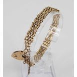 A 9ct gold gatelink bracelet, having heart shaped padlock clasp and safety chain, sponsor JG&S, 9.