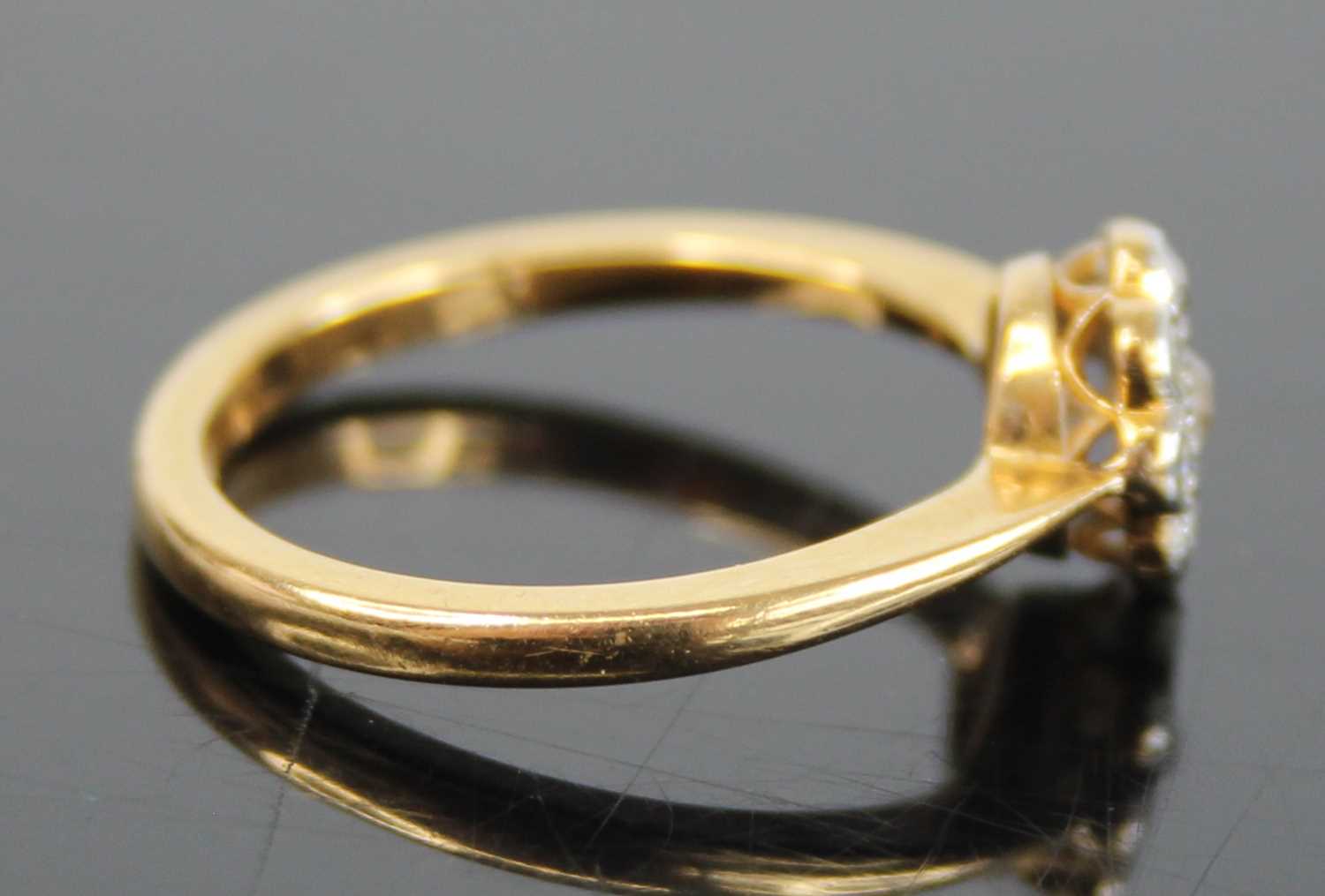 An 18ct gold diamond flower head cluster ring, arranged as a centre round cut within a surround of - Image 3 of 8