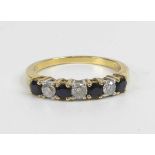 A yellow and white metal, sapphire and diamond seven-stone half hoop eternity ring, comprising