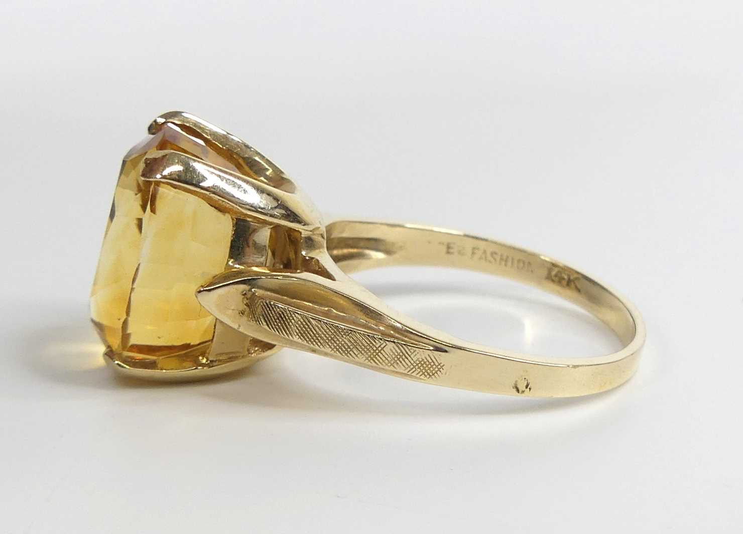 A yellow metal citrine single stone ring, featuring an oval citrine in a four-claw setting with - Image 5 of 7