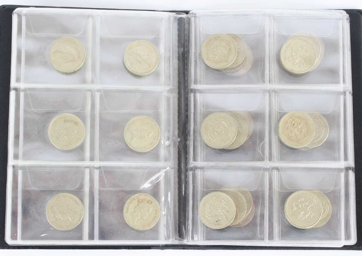 Great Britain, a collection of thirty £1 coins, housed in a coin collection book. (1)