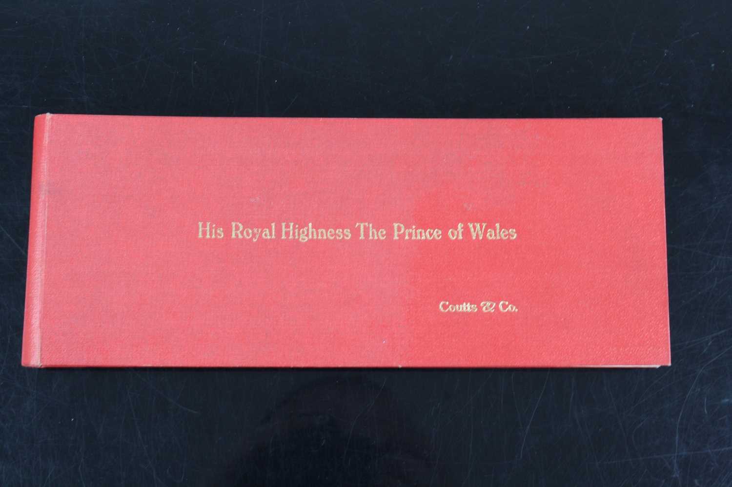 A 20th century Coutts & Co. cheque book, the covers in red cloth with gilt tooled title "His Royal