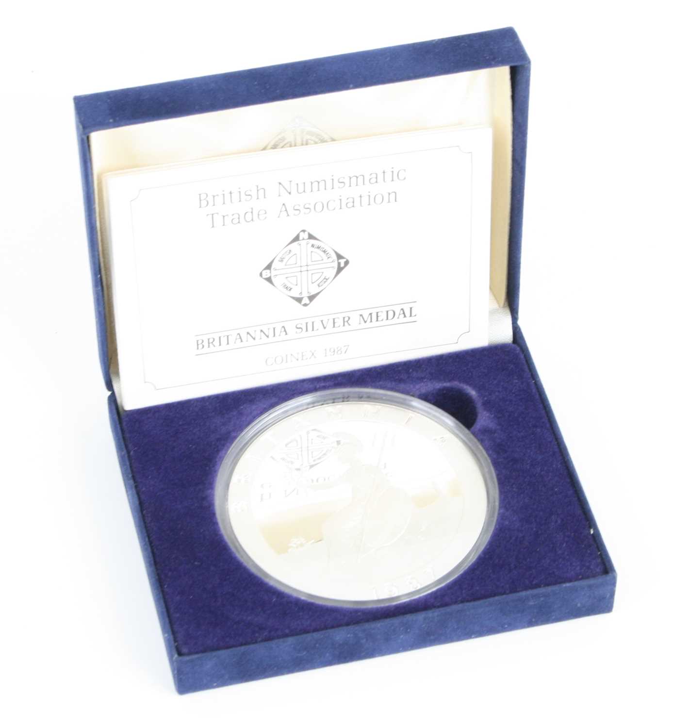 The Birmingham Mint, a British Numismatic Trade Association Coinex 1987 Britannia Silver Medal, obv: