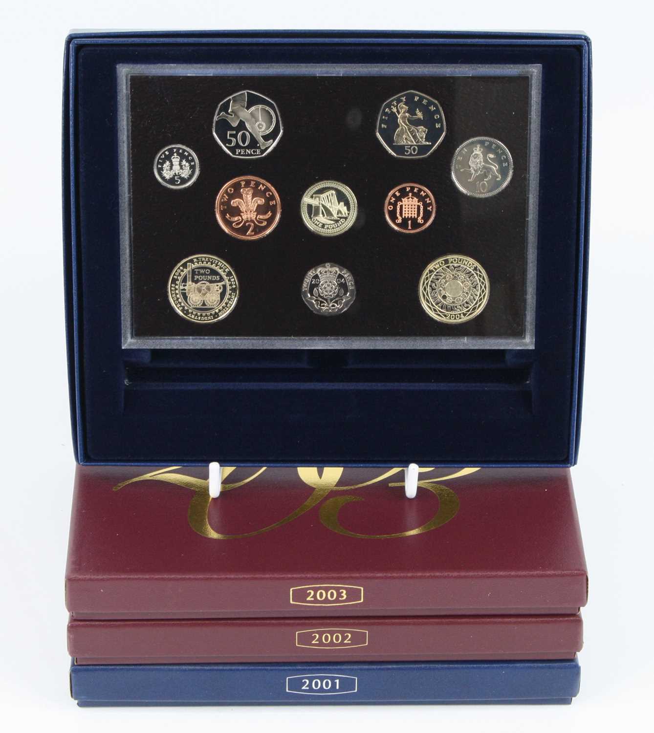 The Royal Mint, a collection of four United Kingdom proof coin sets to include 2001-2004, each cased