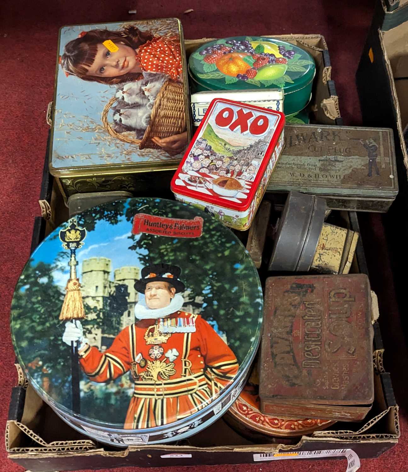 A collection of vintage advertising tins, to include examples by Huntley & Palmers