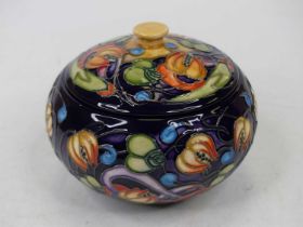 A Moorcroft pottery jar, of squat globular form, tube line decorated in the Celtic Web pattern,
