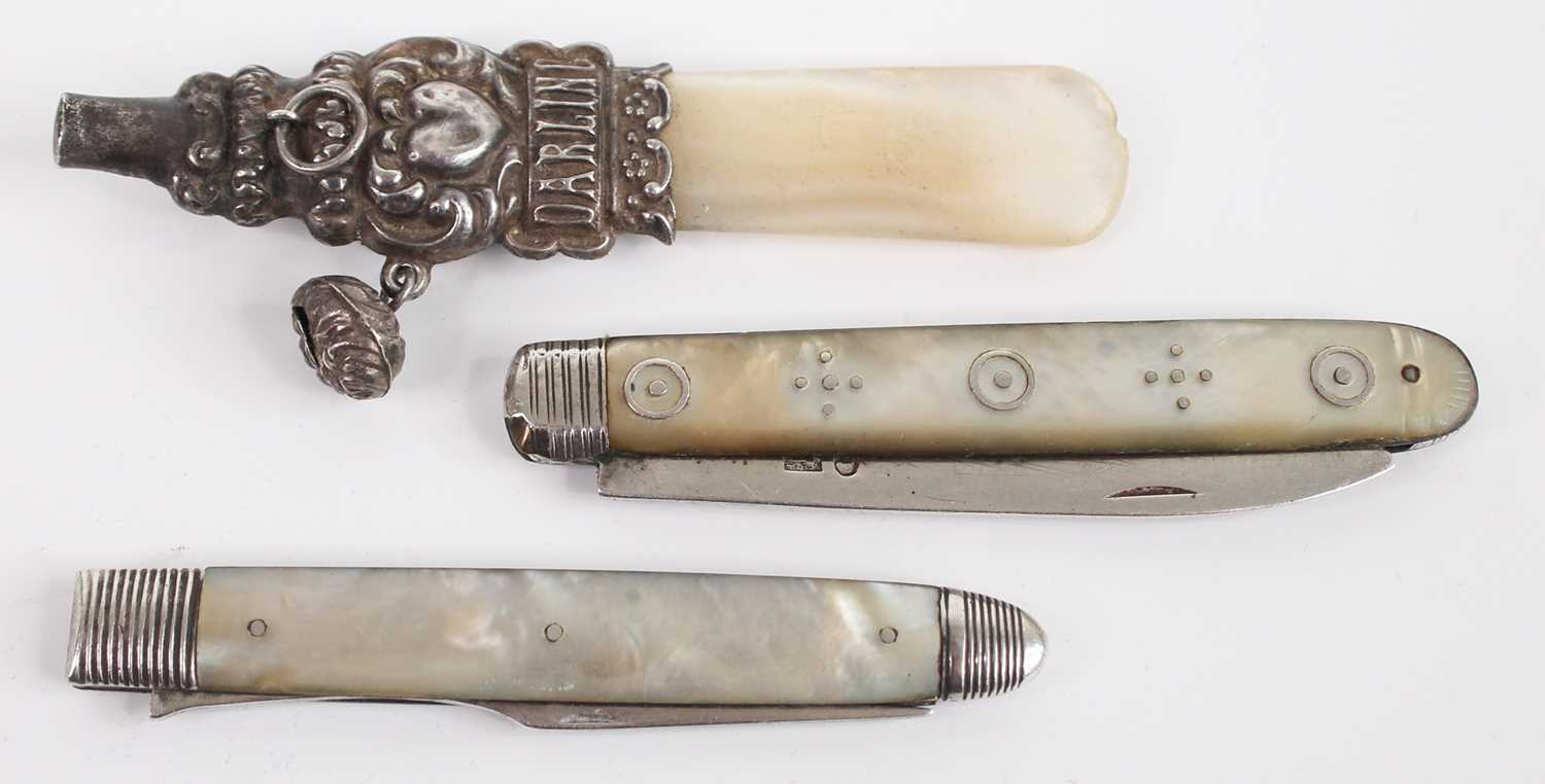 A white metal and mother of pearl teething rattle, annotated Darling; together with a circa 1830