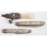 A white metal and mother of pearl teething rattle, annotated Darling; together with a circa 1830