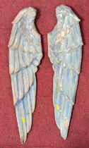 A pair of carved pine and polychrome painted wings, height 79cm