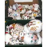 A collection of floral decorated pottery piggy banks (two boxes)