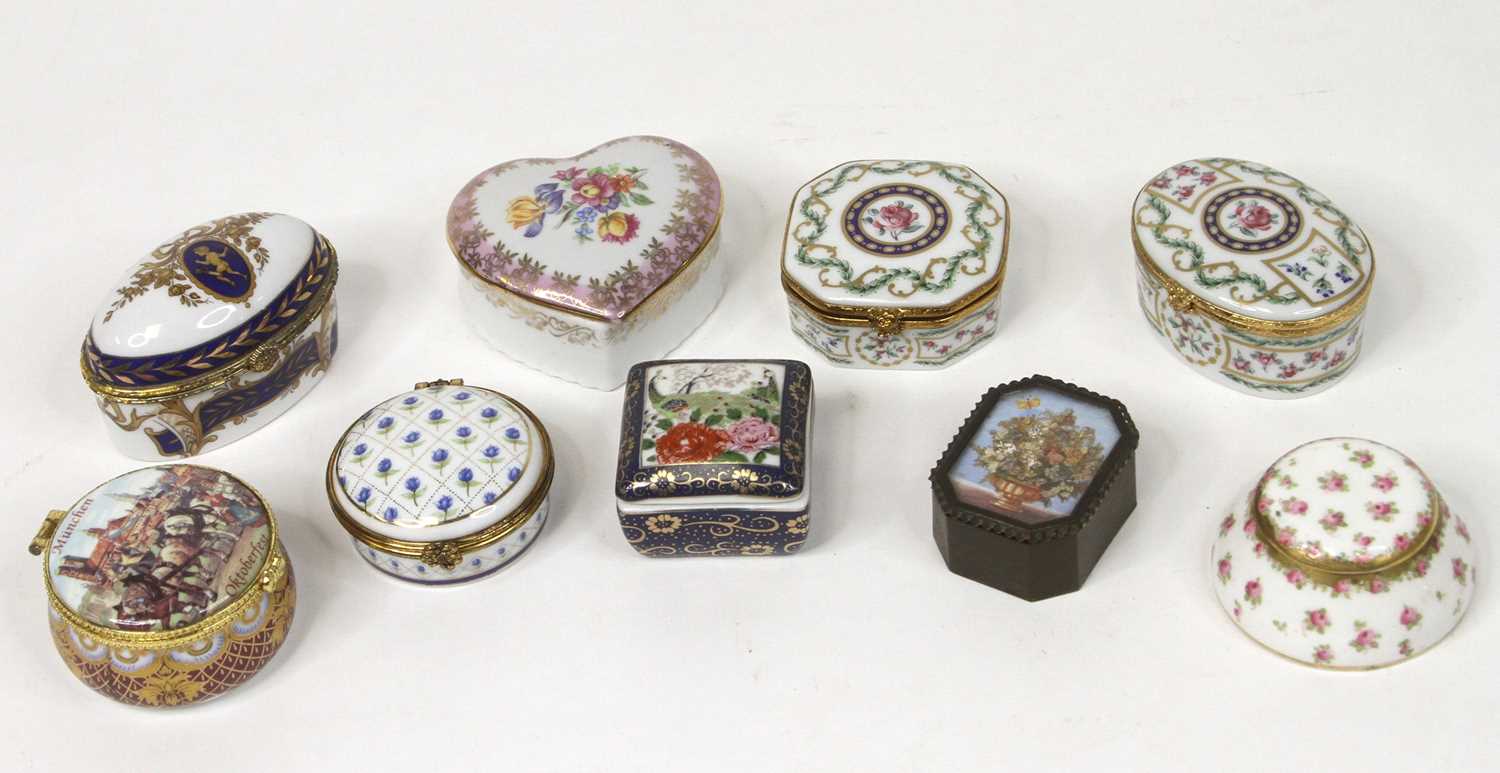 A collection of porcelain trinket boxes, to include Reutter and Limoges