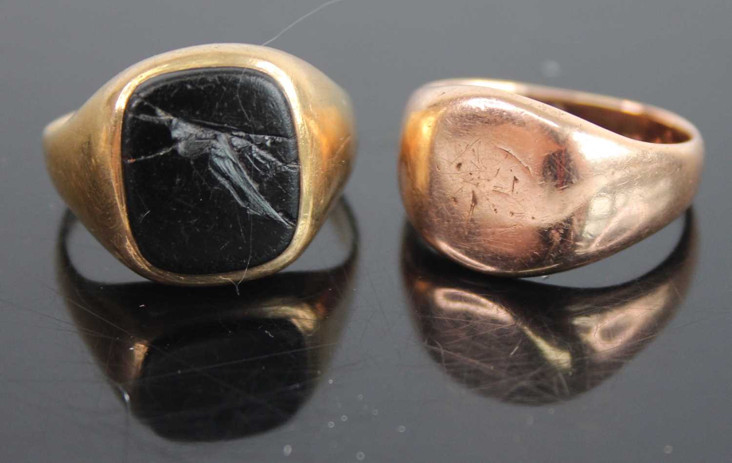 A gent's 9ct gold and black onyx set signet ring, size O; together with another 9ct gold signet