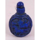 A Chinese carved blue resin snuff bottle, h.8.5cm