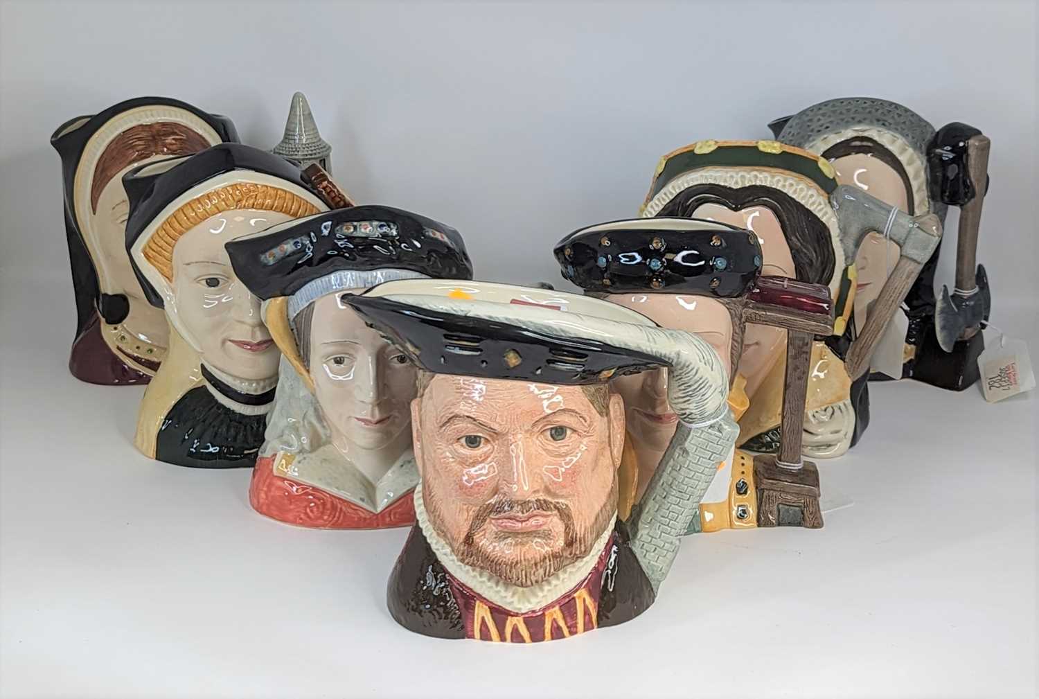 A collection of seven Royal Doulton character jugs, King Henry VIII and his six wives Henry height