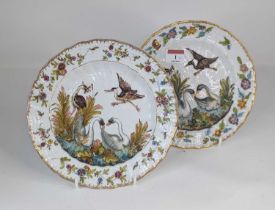 A pair of continental porcelain plates, relief decorated after the Meissen Swan service, possibly