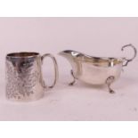 An Edwardian silver christening mug, decorated with foliage, Chester 1906, h.7cm; together with a