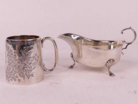 An Edwardian silver christening mug, decorated with foliage, Chester 1906, h.7cm; together with a
